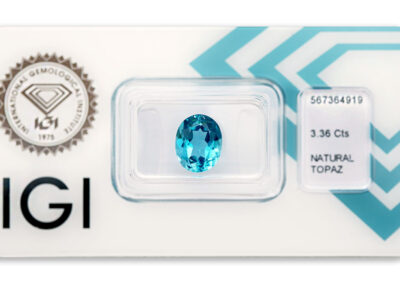 topaz 3.36ct deep greenish blue s IGI certifikátem