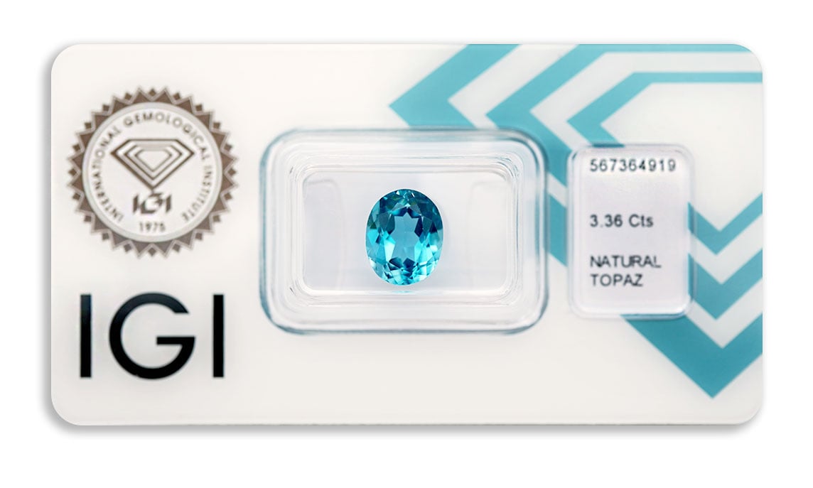 topaz 3.36ct deep greenish blue s IGI certifikátem